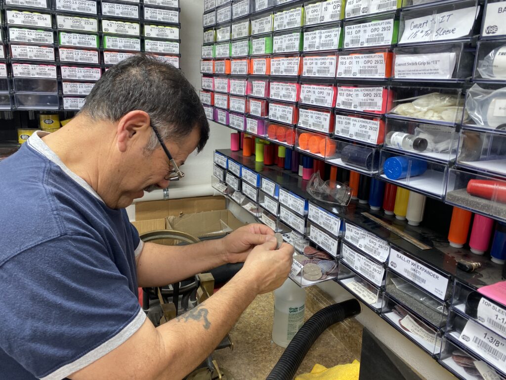 Jorge checking the quantity of the bowling ball slugs 